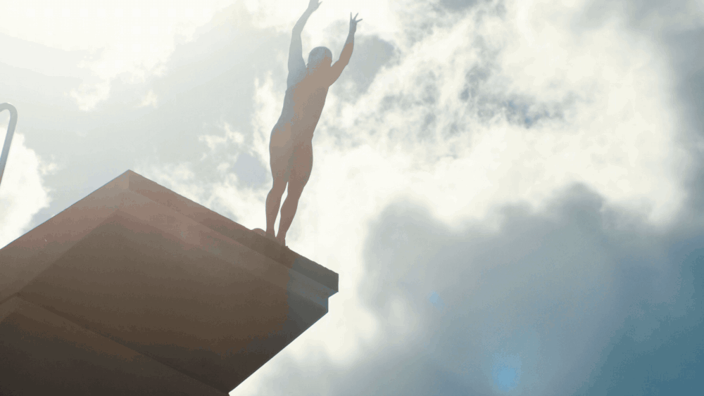A gif from a short film of a diver leaping off of a platform against a cloudy sky