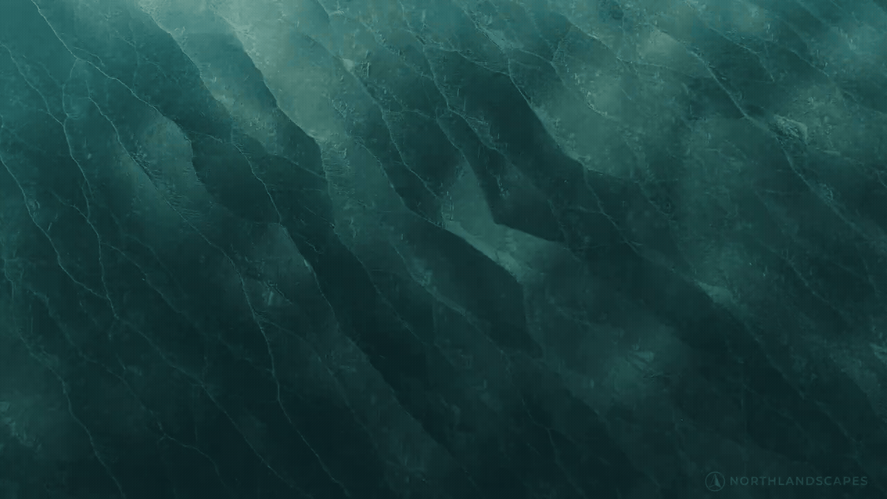 A gif of thin, undulating layers of Baltic Sea ice that look like moving facets