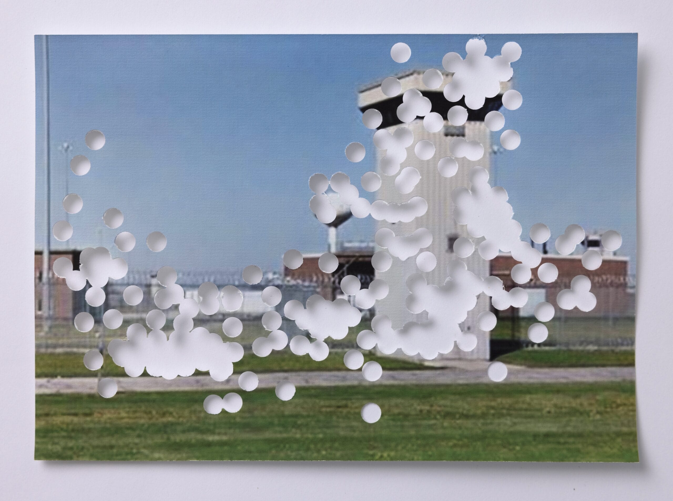 an image of a building with hole punches to obscure the structure