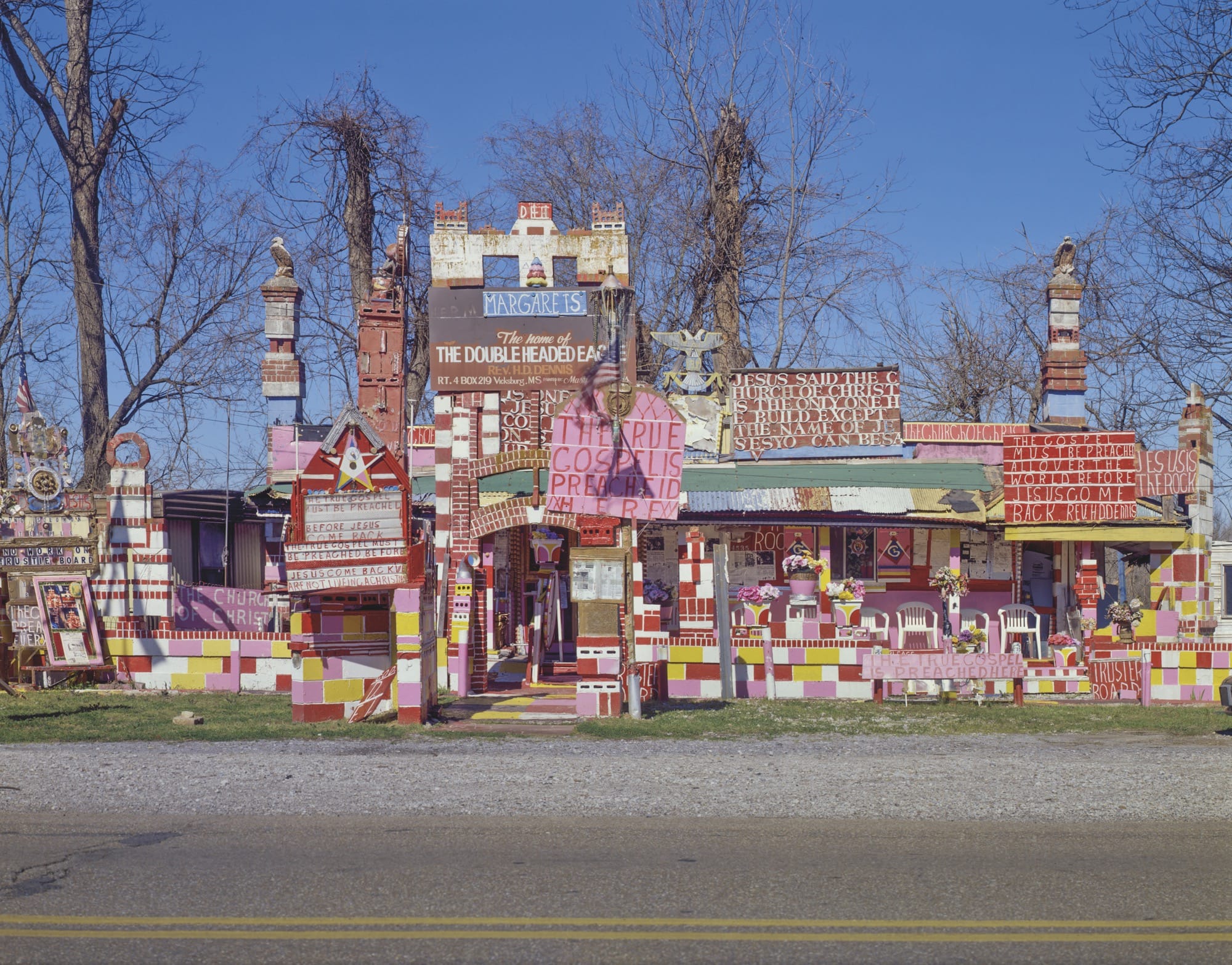 An artist environment by Margaret Rogers Dennis that's heavily embellished with lots of hand-painted signs and decoration
