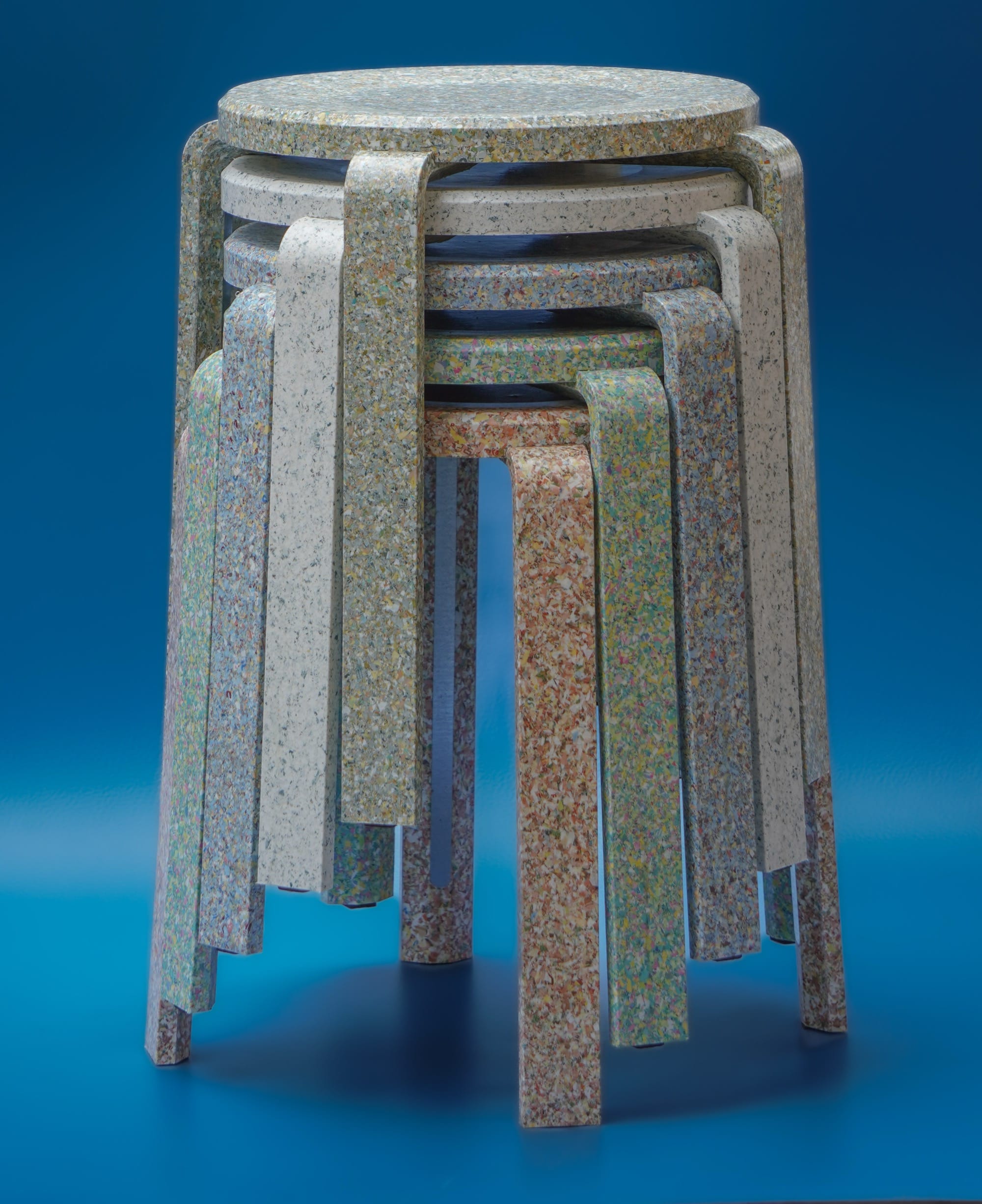A stack of stools made from upcycled plastic-and-cotton banknotes
