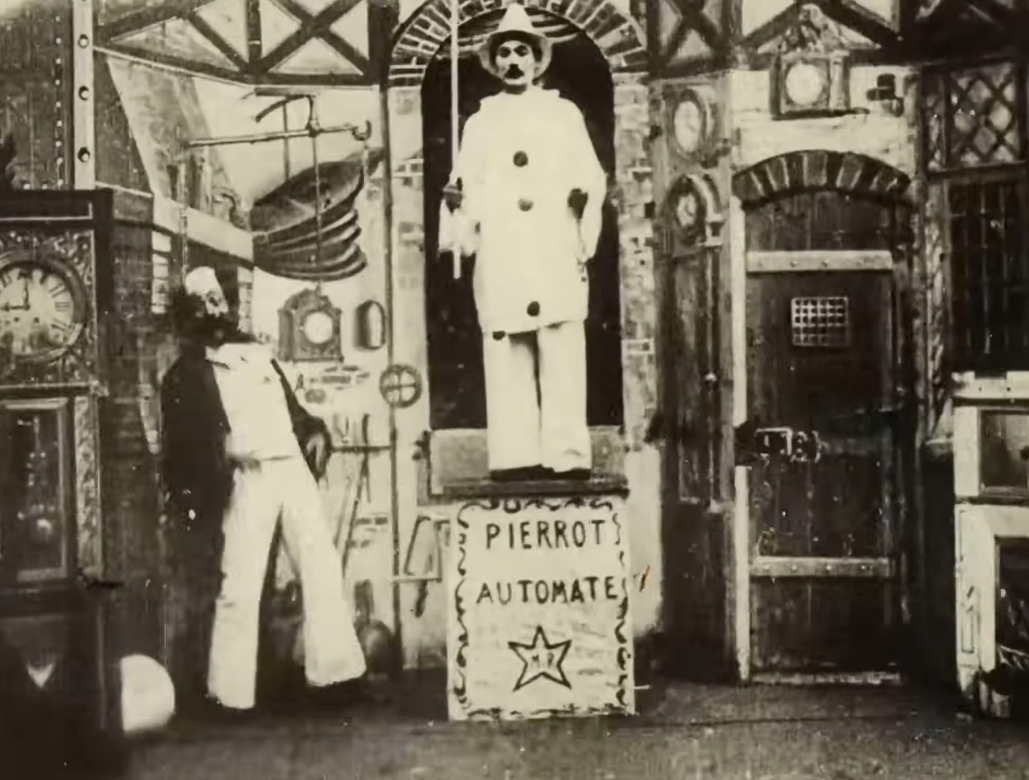 a film still of a magician and automaton
