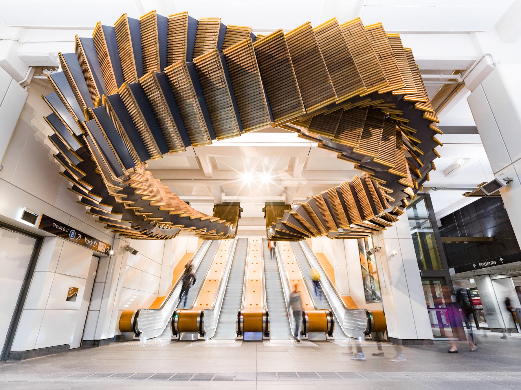 80-Year-Old Wooden Escalators are Repurposed as a Sculptural Ribbon by Artist Chris Fox